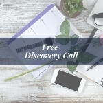 notebook and cell phone on desk banner reading free discovery call